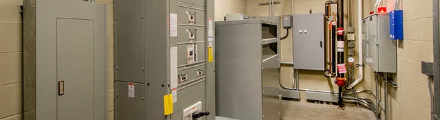 An electricalroom with circuit breakers.